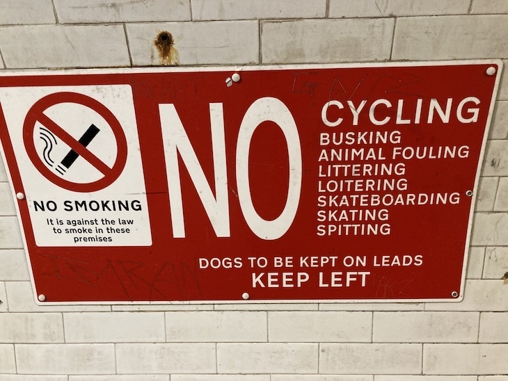 A warning sign of what you can and cannot do in the tunnel. Smoking and cycling are the main no-nos