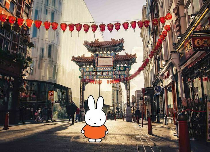 Miffy the rabbit standing in front of a chinatown gate