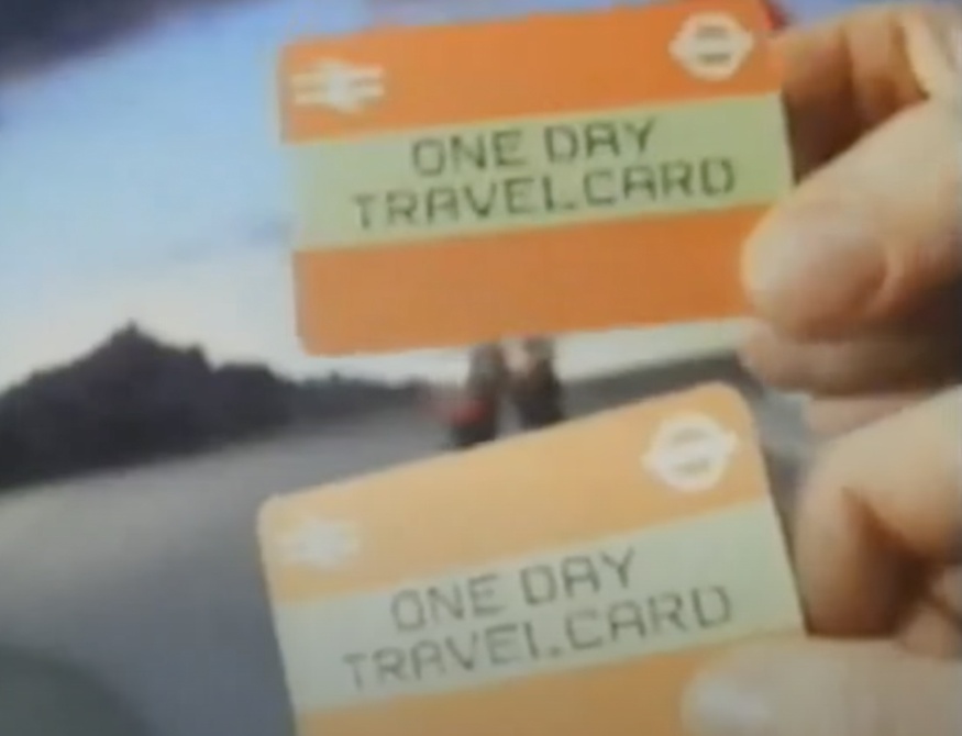 A slightly blurry 1980s shot of two orange day travelcards