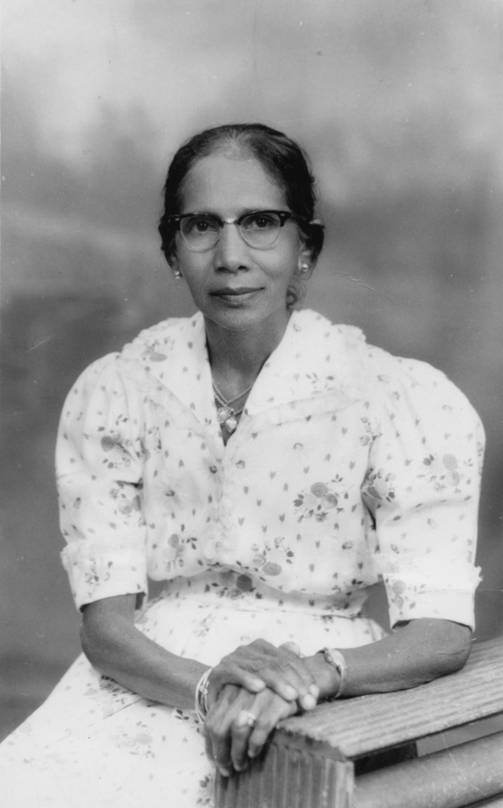 Windrush Day events 2023. Black and white portrait of a woman posing in a white spotted dress