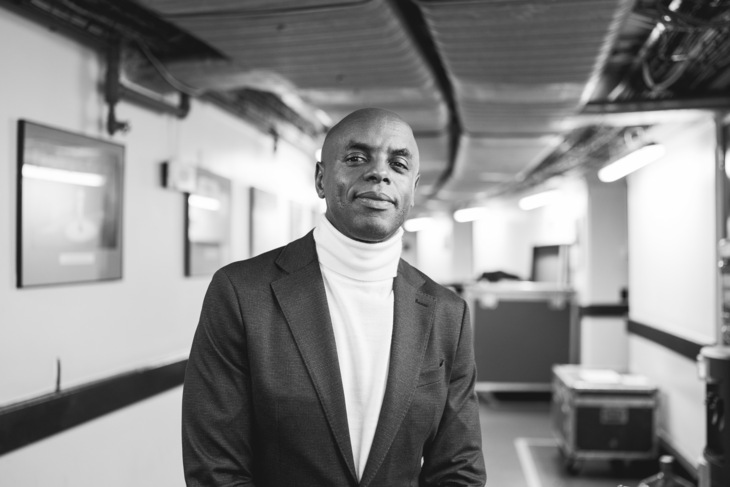Windrush Day events 2023. Black and white image of Trevor Nelson in a jacket and turtleneck