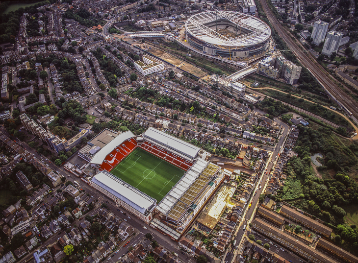 The Emirates being constructed, with Highbury Stadium - still open - in the foreground