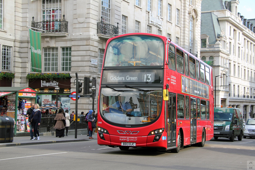 A red double decker with the number 13 on the destination blind - driving through Piccadilly