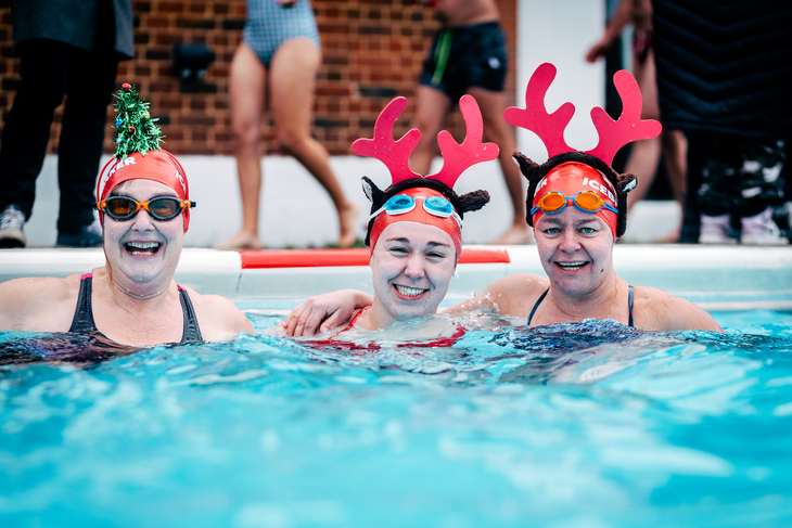 The people with Christmassy headgear in the water