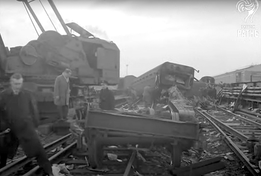 Black and white still of the train wreckage