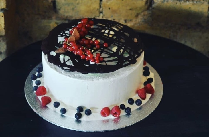 Where To Eat And Drink In Upton Park And East Ham:  a cake decorated with berries and chocolate