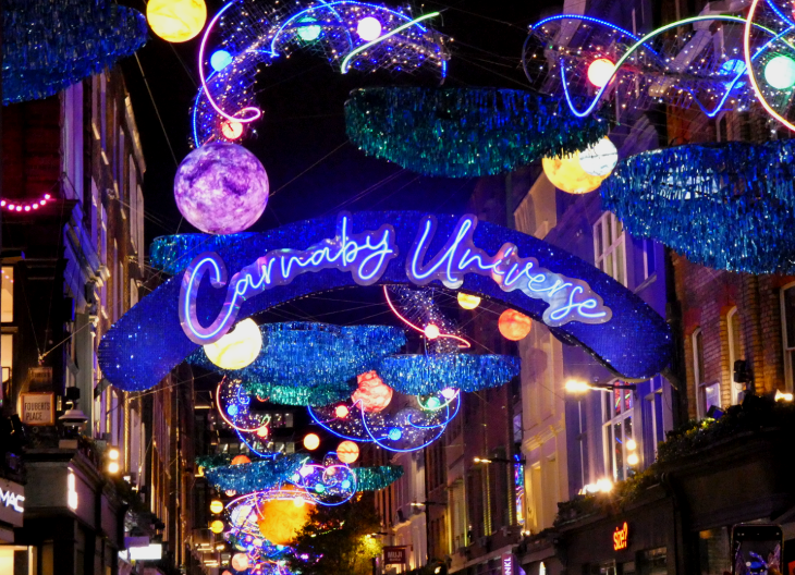 Brightly coloured signs and lights over Carnaby Street