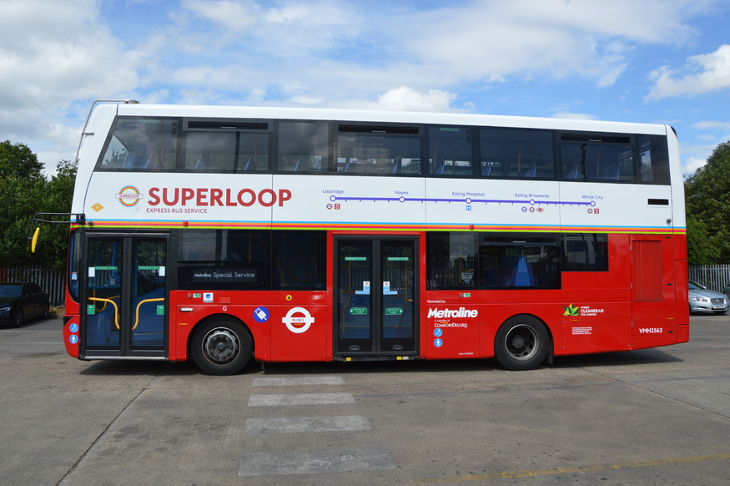 A Superloop bus, red on the bottom half - white and with Superloop branding on the top