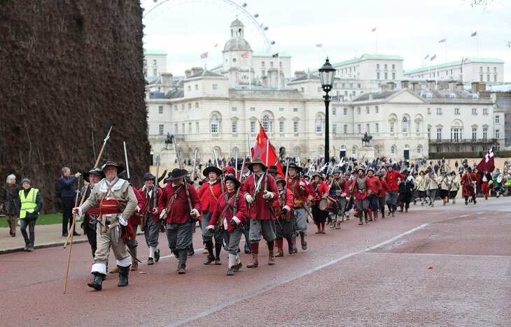 A parade of reenactors - with Horseguards and the London Eye in the background