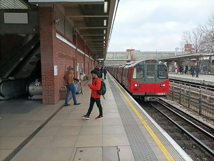 A tube train pulling into West Ham