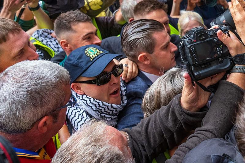 Headline: Kneecaps Mo Chara Faces Court Amid Supportive Crowd as Terror Charge Sparks Political Controversy